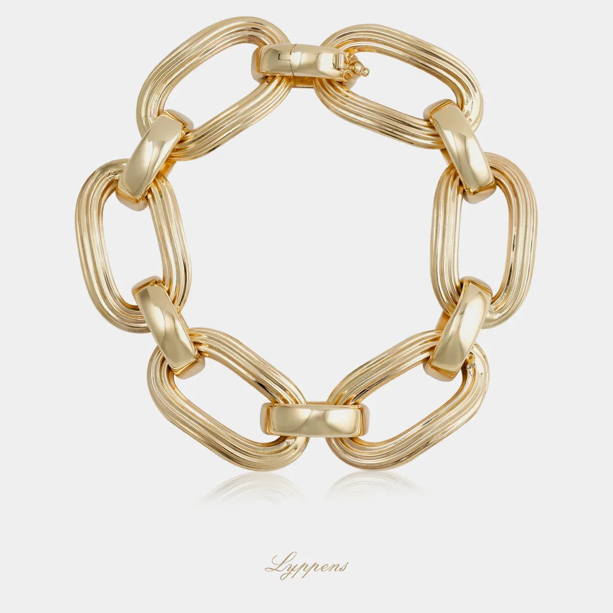 Geelgouden fantasie schakelarmband